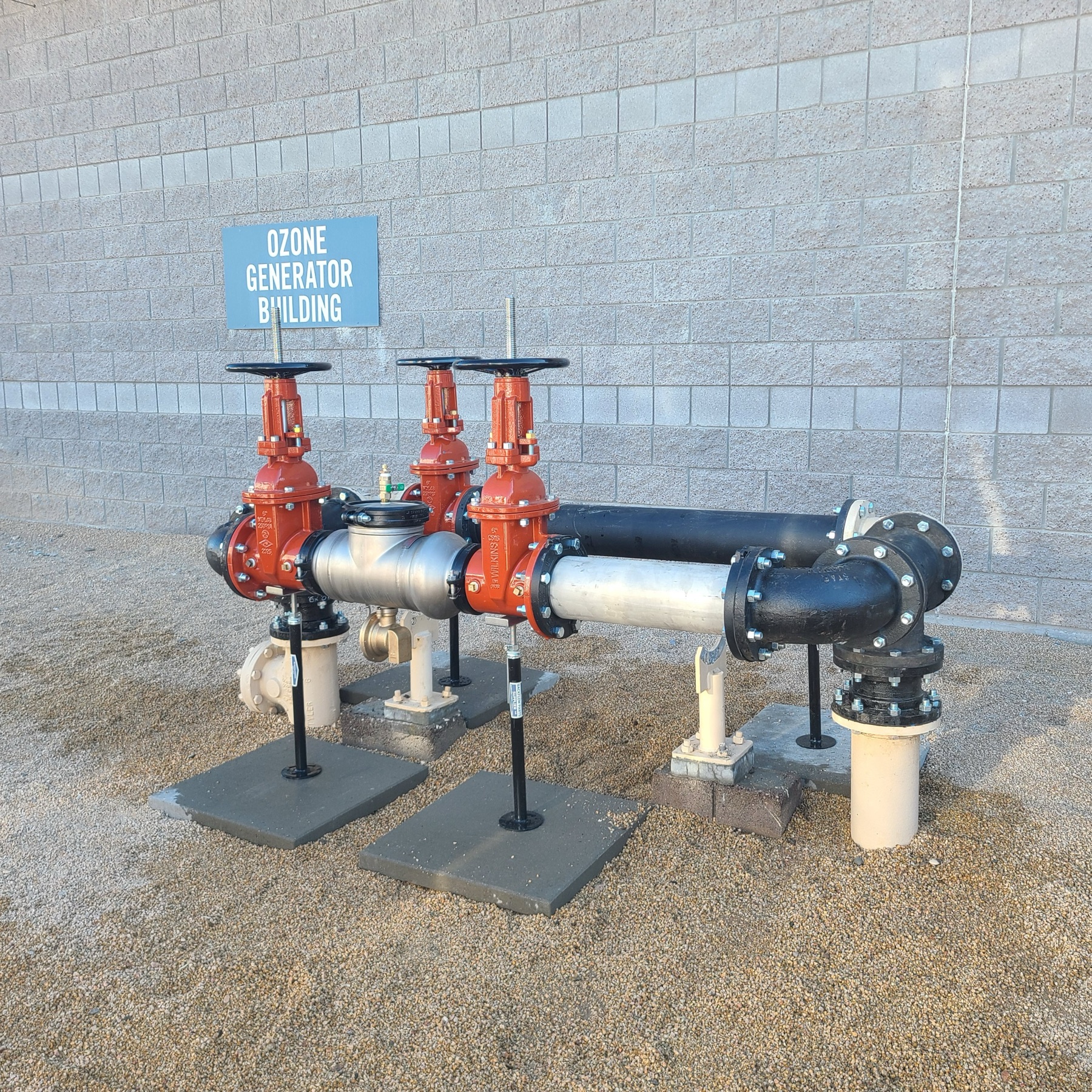 Completed commercial fire backflow installation with new valves and supports