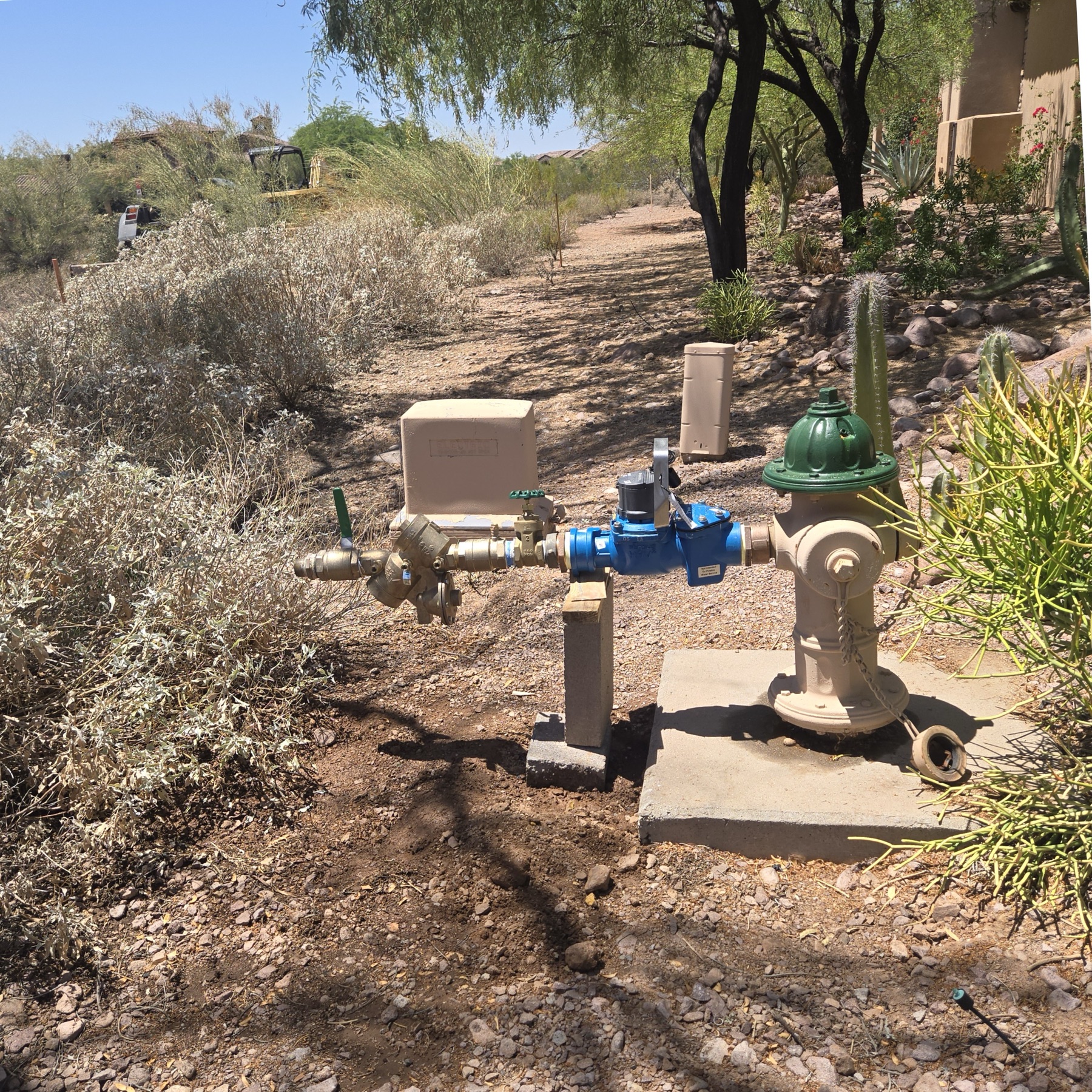 Hydrant and backflow connection installed in Arizona desert landscaping